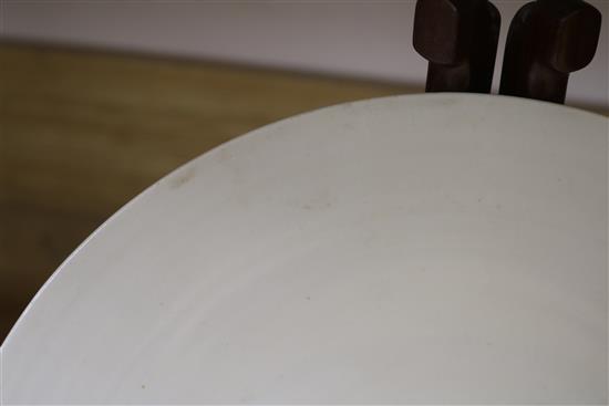 A Chinese cream glazed bowl on stand